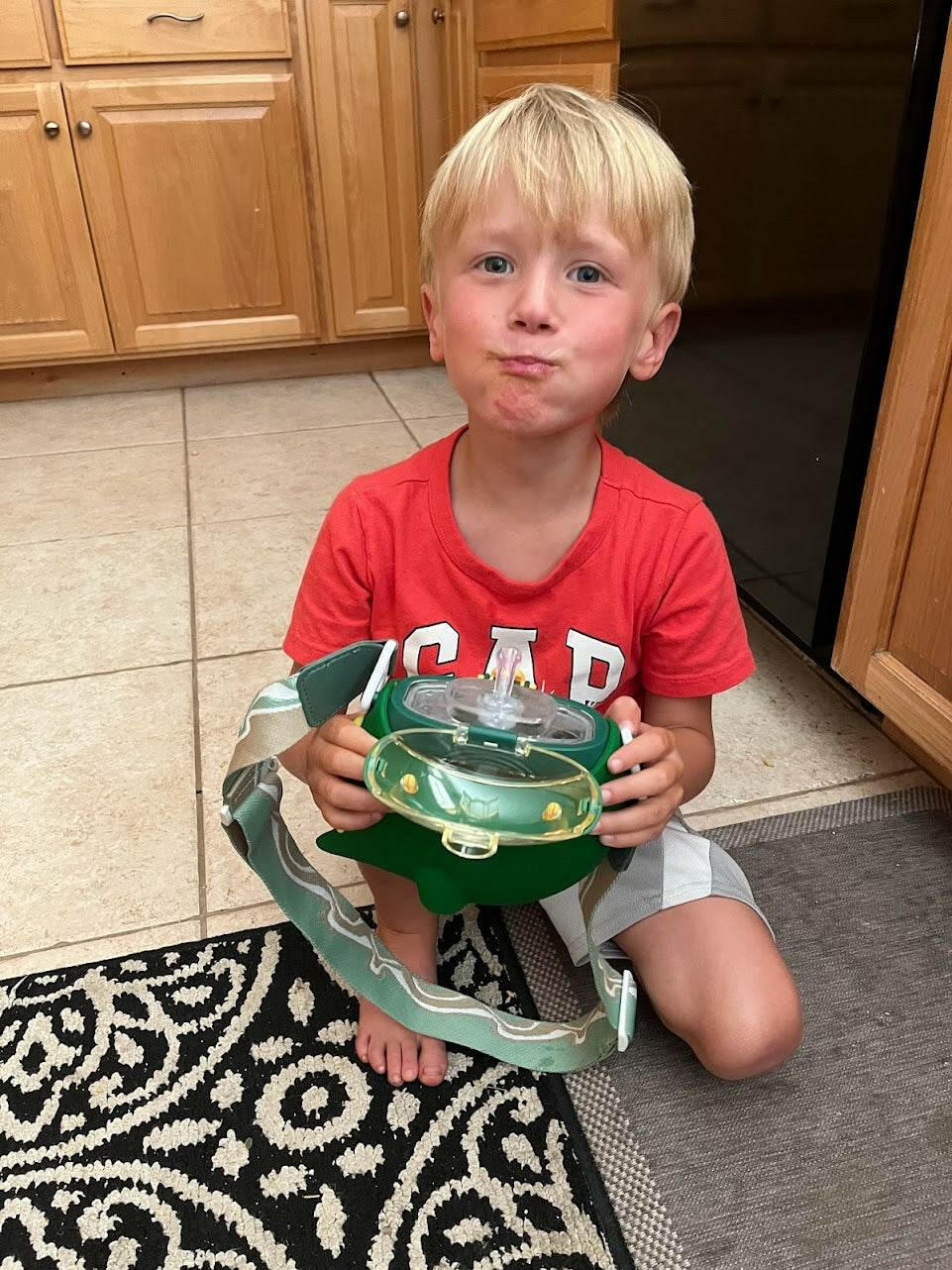 Dinosaur Round Bottle with Lanyard.