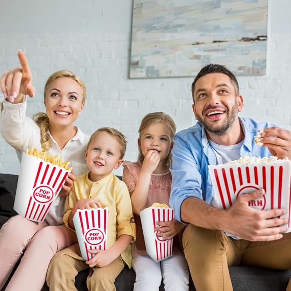 Family enjoying popcorn from reusable cinema-style containers at home