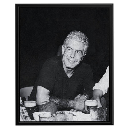 Wownic Anthony Bourdain poster featuring a candid black-and-white dining portrait in a relaxed restaurant setting