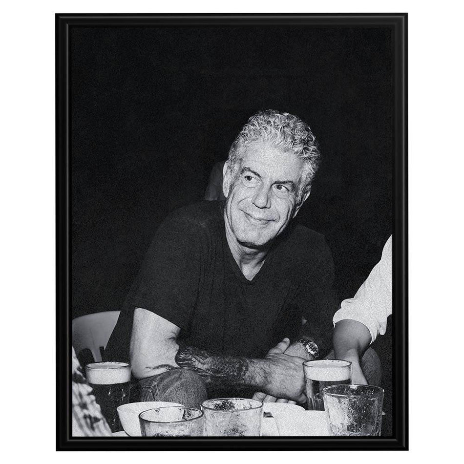 Wownic Anthony Bourdain poster featuring a candid black-and-white dining portrait in a relaxed restaurant setting