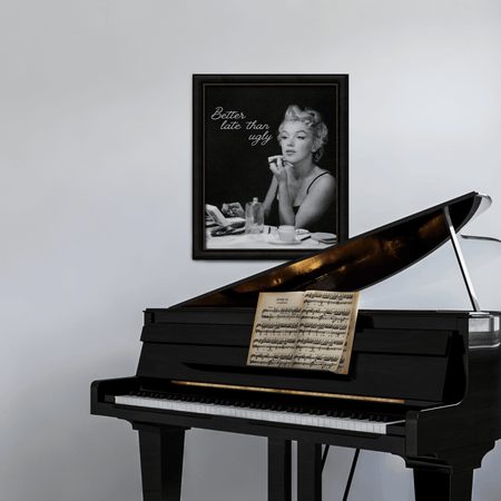 Wownic Better Late Than Ugly black-and-white wall art displayed as framed decor above a grand piano