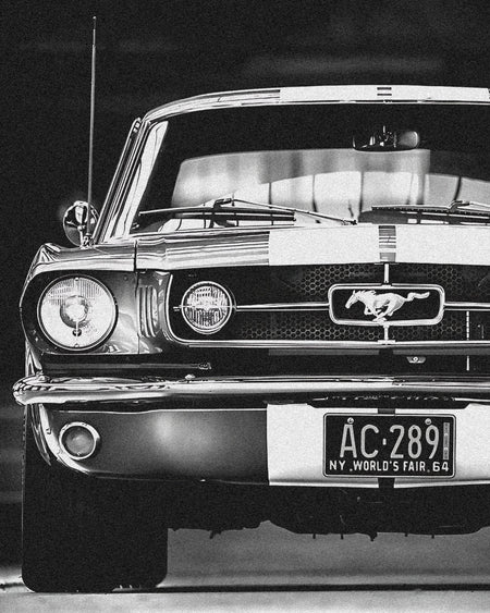 Wownic classic Mustang-inspired muscle car poster featuring a black-and-white front view with pony grille emblem and chrome bumper