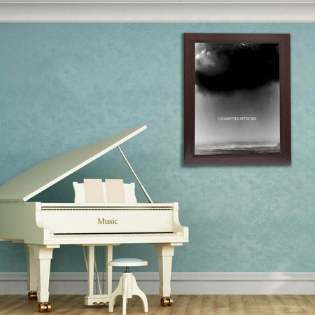 Wownic Cry music poster displayed as framed monochrome wall art in a music room above a piano