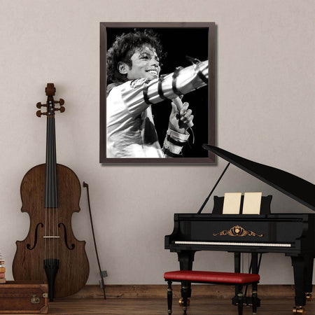 Wownic Michael Jackson music poster displayed as framed black-and-white wall art in a music room above a piano
