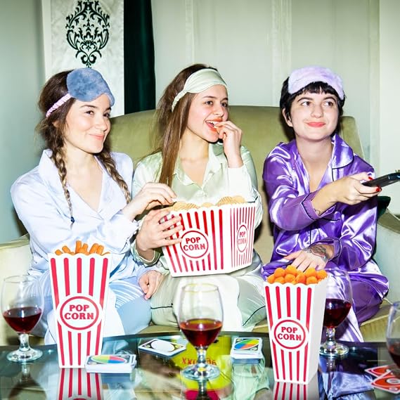 Friends enjoying snacks from Wownic popcorn containers during movie night
