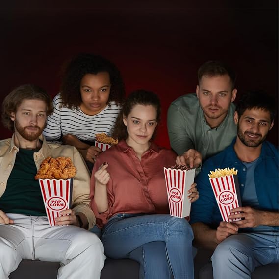 Friends enjoying snacks from Wownic reusable popcorn buckets during movie night