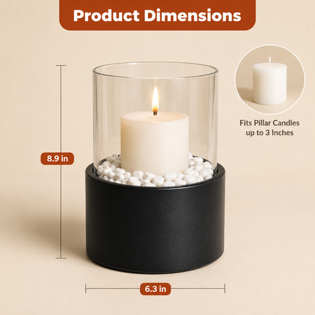 Product dimensions graphic for a black cylindrical candle holder with a clear glass cylinder and white decorative stones, shown with a lit cream pillar candle inside. 