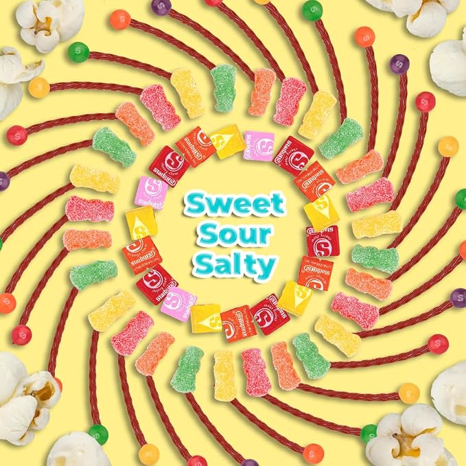 Sweet sour and salty movie night candy assortment with popcorn and colorful treats